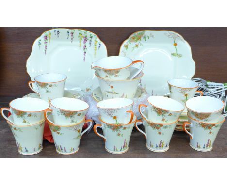 A twelve setting Art Deco tea service, Collingwood Bone China, England, sugar bowl restored