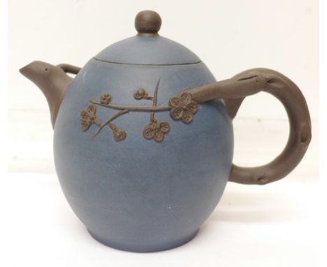 A blue ceramic oriental teapot, mark on base