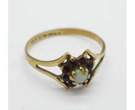 A 9ct gold, opal and garnet ring, 1.2g, P, opal a/f