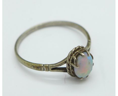 A silver and opal ring, Q