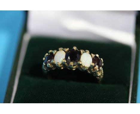 A Victorian 9ct gold opal and garnet set ring