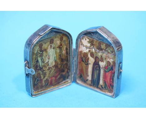 A small Russian silver and jade pocket fold icon; with carved jade panels to the front and back opening to reveal two decorat