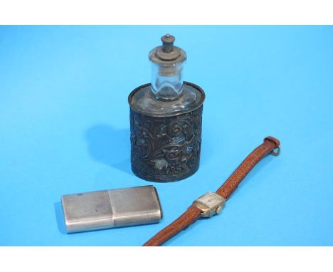 A silver mounted scent bottle, a silver engine turned 'Howitt' lighter and a ladies 9ct gold watch