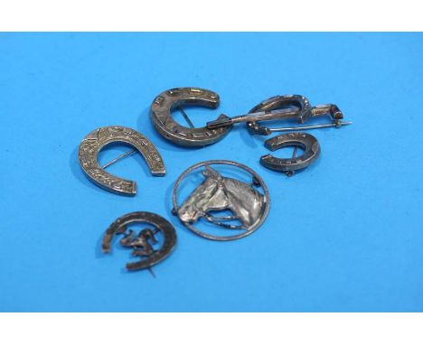 Six various silver and silver coloured hunting brooches, including a horseshoe and whip inset with coloured agate