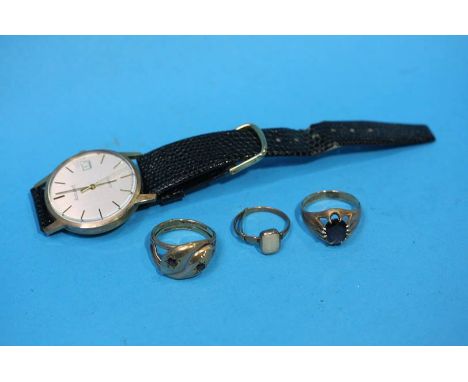 A Gentlemans 9ct gold 'Accurist' wrist watch, two 9ct gold gentlemans rings and a 9ct Opal ring; total weight 12.9 gram (excl