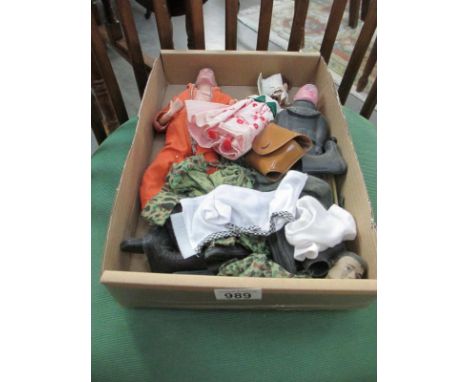 An Action Man, clothes, a doll etc