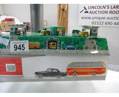 A tin plate automaton of buses and cars