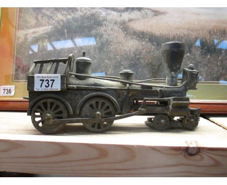 A heavy metal model of a steam engine