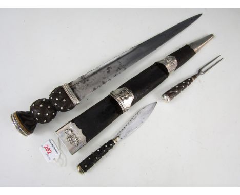 An early 19th Century Scottish white metal mounted dirk, the blade stamped Macleod, 2 College St, Edin**, the scabbard mounts