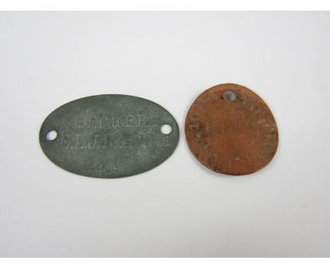 A First World War British Army fibre identity disc and a German identity disc