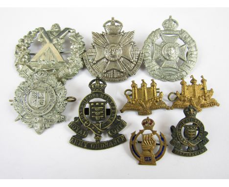 A small quantity of British Army metal insignia including a 5th Battalion Border Regiment cap badge