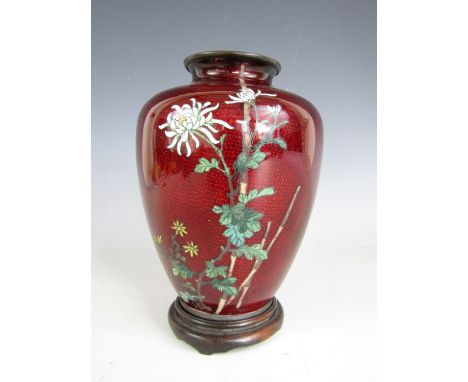 A Meiji / Taisho Japanese cloisonne enamel vase of shouldered ovoid form, decorated in depiction of chrysanthemum on a red to