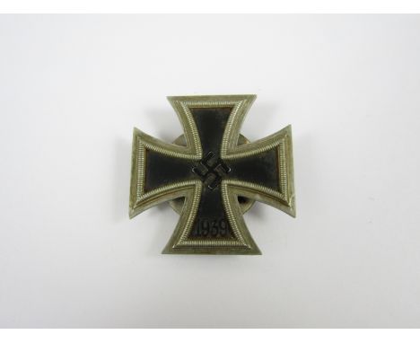 A German Third Reich Iron Cross first class, having a screw-back, maker-marked L/21