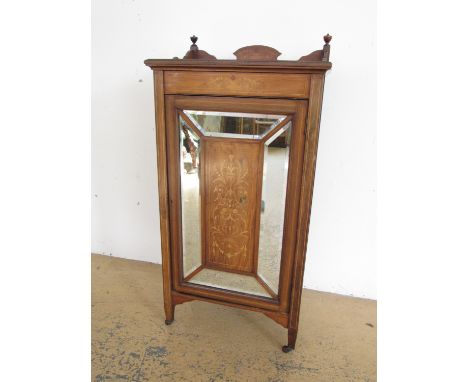 A Victorian marquetry-inlaid rosewood music cabinet, having three quarter gallery top, single mirrored door centred by an inl