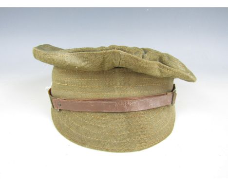 A First World War trench cap (date indistinctly printed)