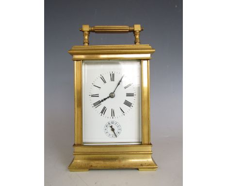 A late 19th Century French carriage alarm clock, striking the half hours, 15 cm excluding handle