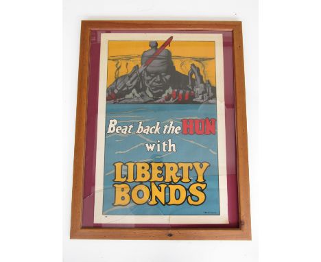 A First World War fund-raising poster Beat Back the HUN with Liberty Bonds, designed by Frederick Strothmann, framed under gl