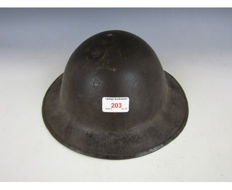 A First World War British Brodie pattern steel helmet (chin strap incomplete)
