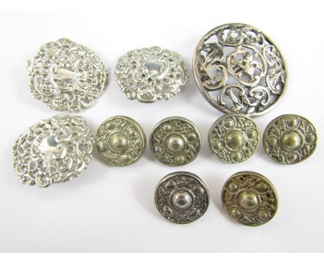 Victorian and later silver buttons, including one cast and reticulated button, London, 1889, three Art Nouveau buttons in a s