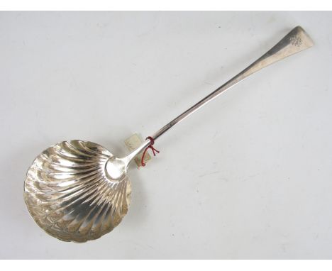A George III Old English pattern silver soup ladle, with scallop shell bowl and engraved monogram to the terminal, Thomas Dic
