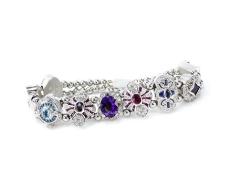 Vintage R. Klein 14 Karat White Gold and Diamond, Ruby, Sapphire, Amethyst and Blue Topaz Charm Bracelet. Signed R. Klein 14K