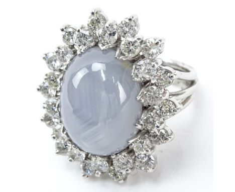 Vintage Approx. 22.0 Carat Oval Cabochon Star Sapphire, 4.0 Carat Round Brilliant Cut Diamond and Platinum Ring. Star sapphir