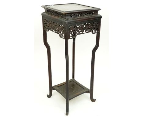 19/20th Century Chinese Carved Plant Stand. Pierced foliage apron, stands on cabriole legs connected by stretcher shelf. Rubb