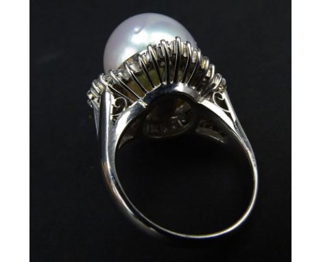 Vintage 14mm South Sea Pearl, 1.37 Carat Tapered Baguette and Round Brilliant Cut Diamond and Platinum Ring. Pearl with good 