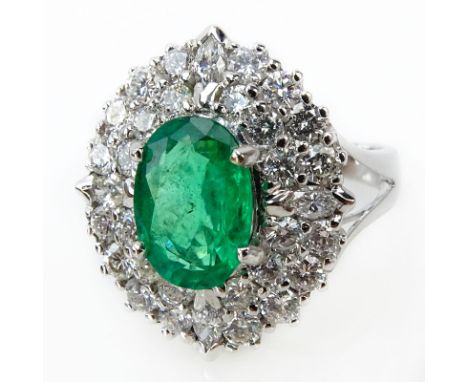 Approx. 2.16 Carat Oval Cut Emerald, 1.76 Carat TW Diamond and 18 Karat White Gold Ring. Emerald with vivid saturation of col