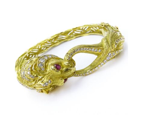 Vintage Approx. 3.57 Carat Round Brilliant Cut Diamond, Ruby and Heavy 18 Karat Yellow Gold Lion Bangle Bracelet. Stamped 750
