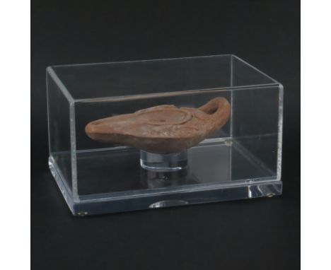 In the Manner of Byzantine Empire Terracotta Oil Lamp in Lucite Display Case. Possibly circa 300- 400 A.D. Natural wear and p