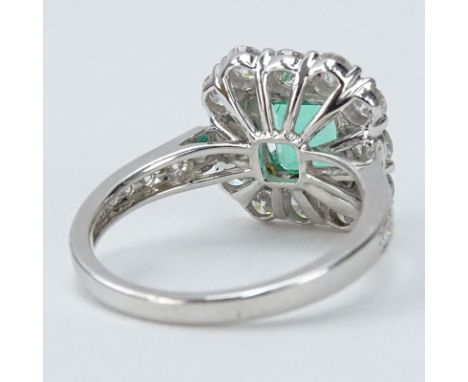 Approx. 1.55 Carat Round Brilliant Cut Diamond, Square Cut Emerald and 18 karat White Gold Halo Ring. Diamonds G-H color, VS 