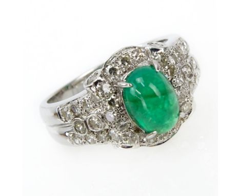 Approx. 1.43 Carat Cabochon Emerald, .64 Carat Diamond and 18 Karat White Gold Ring. Signed 18K 750. Very good condition. Rin