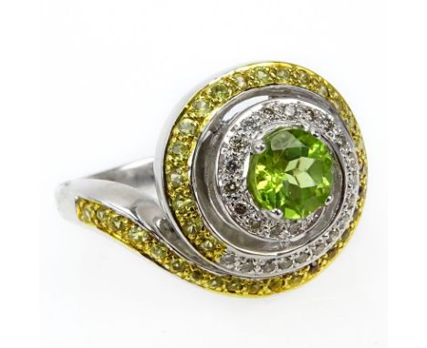 Approx. 1.02 Carat Round Brilliant Cut Peridot, Fancy Yellow and White Diamond and 18 Karat Yellow and White Gold Swirl Ring.