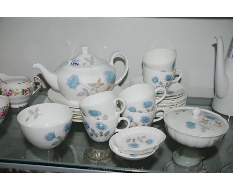 A Wedgwood 'Ice Rose' part Tea and dinner service including thirteen saucers, six each cups and salad plates, dinner plate, s