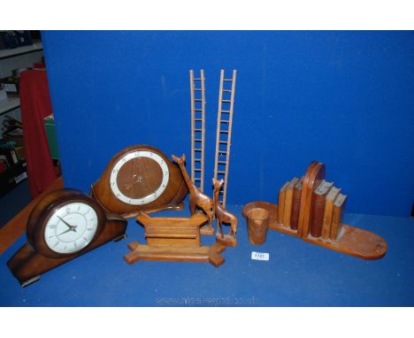 A box of Treen including a 1950's walnut mantle clock, Tempora mantle clock, two carved Giraffes, Yew wood beaker, oak pen st