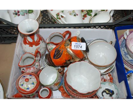 A quantity of Oriental china including coffee cups, saucers, tea bowls, vases, etc.