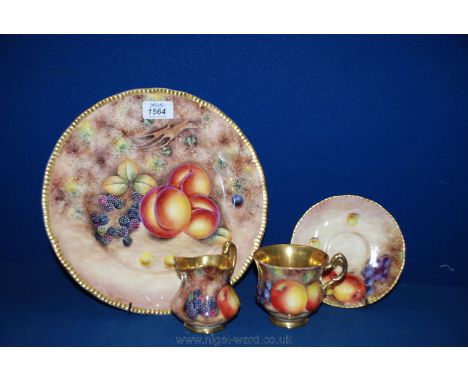 A large colourful Plate, cup, saucer and Jug by Gerald Delaney, (ex-Royal Worcester artist) hand decorated with fruit design.