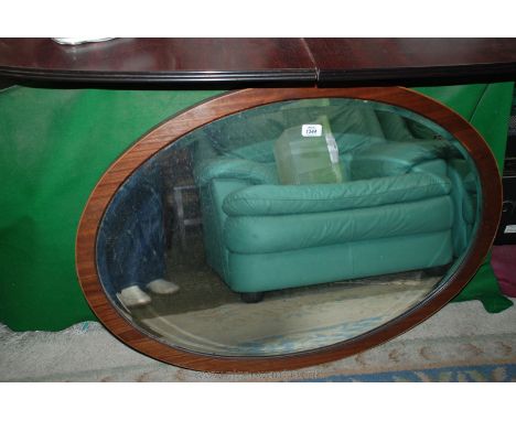 An oval Rosewood framed bevel plate Mirror.