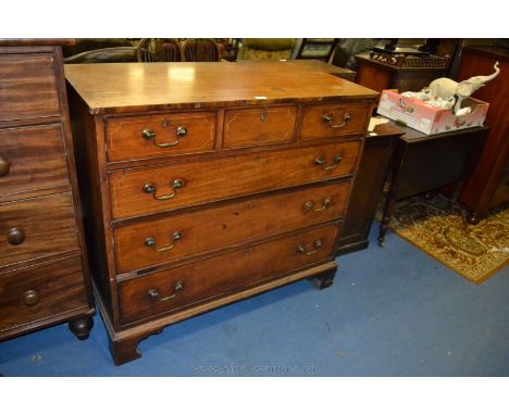 An early 19th c. Mahogany Chest of six Drawers, having plain rectangular top over the three short frieze drawers, over three 