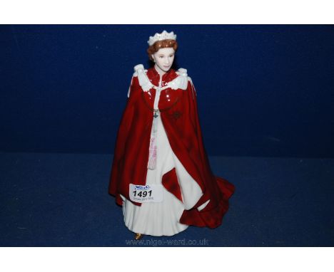 A Royal Worcester figure 'In Celebration of The Queen's 80th Birthday' ,dressed in the robes of The Order of The British Empi