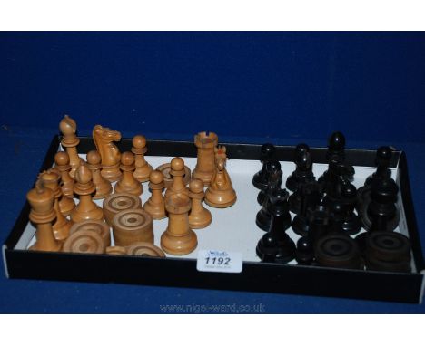 A carved wooden Chess Set and Draughts by Jaques of London.
