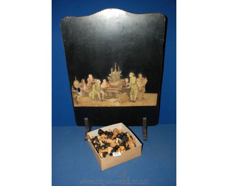 A quantity of carved Chess and Draught pieces, and a wooden Firescreen