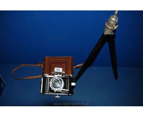 A Ross Ensign folding bellows Camera having Rosstar 105 mm F/4.5 lens and original case together with a German made folding t