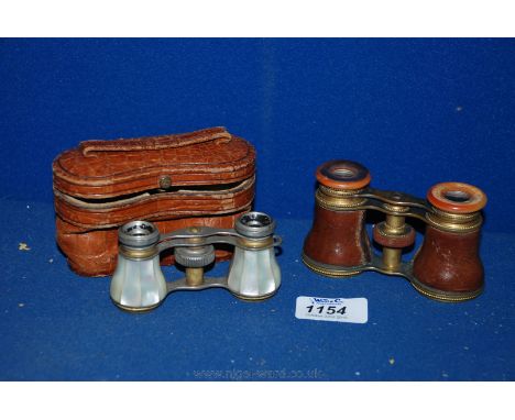 A pair of ladies Mother of Pearl Opera Glasses in a faux Crocodile leather case and another pair of leather bound French Oper