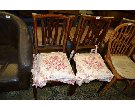 A pair of Edwardian Mahogany Bedroom Chairs, having crossbanded backs with elegant fret-cut pierced splat, applied tapestry s