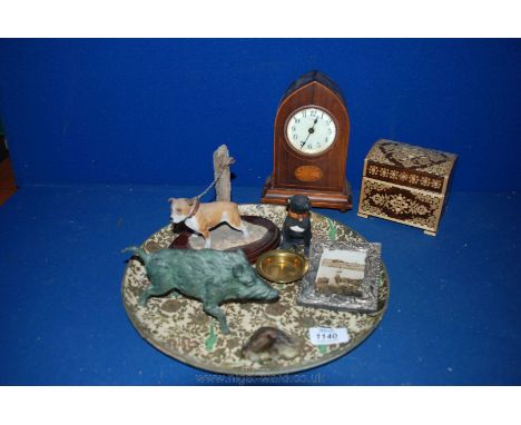 A tray with a six day mantle Clock, figures of dogs, Wild Boar in metal, white metal picture frame decorated with dragons, et