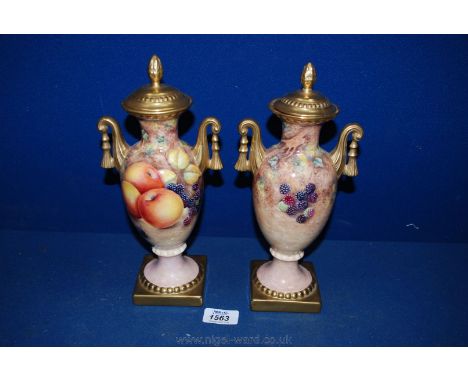 Two lidded Urn shaped Vases by Gerald Delaney (ex-Royal Worcester artist) hand decorated with fruit design.