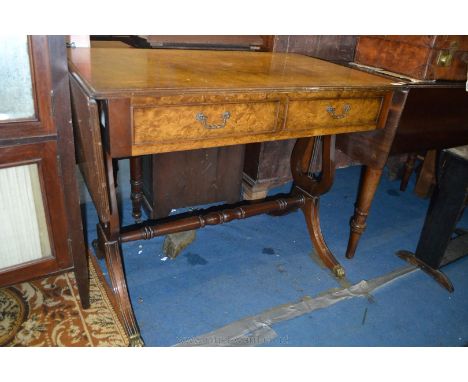 A reproduction Burr Walnut finished, lyre ended Sofa Table having pair of frieze drawers to one side and false drawer fronts 