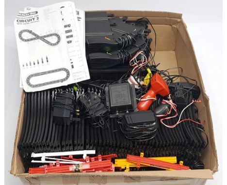 Scalextric (or similar) loose track, hand-held controllers, power supply packs and accessories, none of the powered component